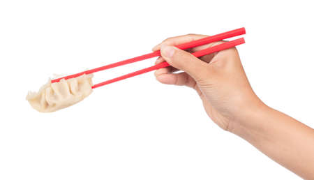 hand holding wonton by chopsticks isolated on white background.の写真素材