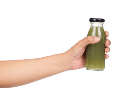 hand holding bottle of guava juice isolated on white background.