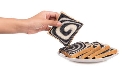hand holding charcoal bread  isolated on white background