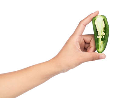 hand holding slice chili pepper isolated on a white background