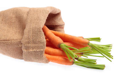 fresh baby carrot in sack  isolated on white background.の写真素材