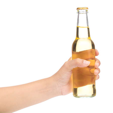 hand holding yellow Whisky Bottle isolated on white backgroundの写真素材