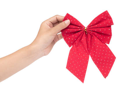hand holding Red bow isolated on white background.の写真素材