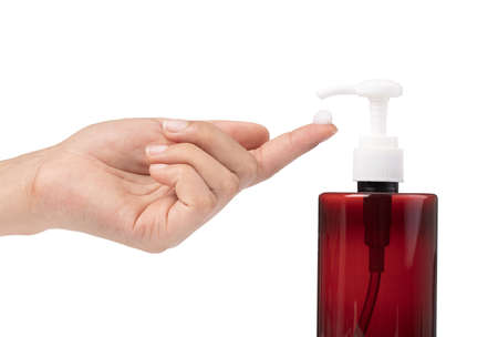 young female hands pumping liquid soap from container isolated on white background
