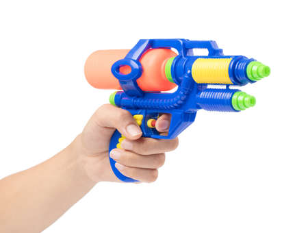 Gun water toy on hand isolated on a white background