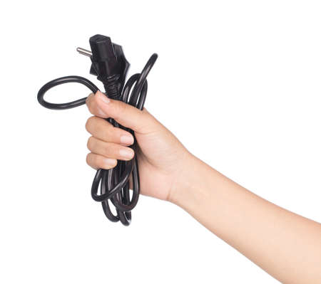 hand holding 3 pin mains plug isolated on white background