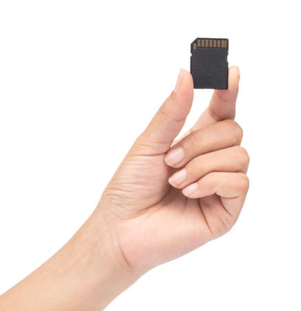 hand holding SD memory card isolated on white background