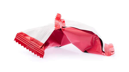 chocolate candies in plastic bag isolated on white background