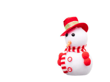 snowman toy dressed in scarf and cap isolated on white background.の写真素材