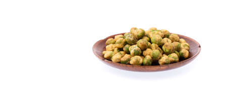 roasted Green beans snacks coated by flour and spicy on wood dish isolated on white backgroundの写真素材