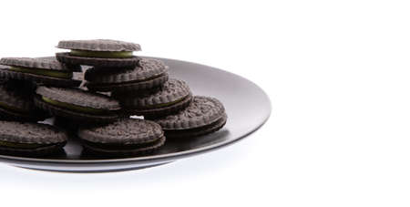 dish of cookie biscuits with green tea filling isolated on white backgroundの写真素材