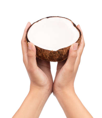 hand holding Coconut Old brown isolated on white backgroundの写真素材