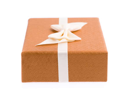 orange gift box with ribbon isolated on white background.の写真素材