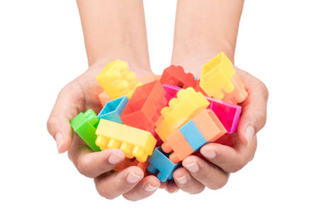 hand holding Blog plastic, building block isolated on white background
