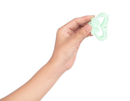 hand holding plastic hair clip isolated on white backgroundの写真素材