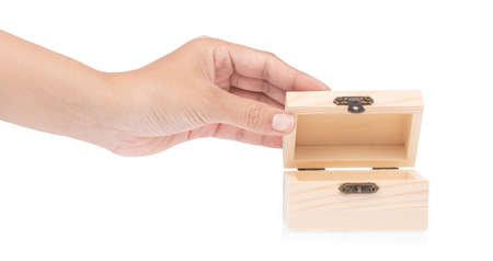 hand holding wooden of chest isolated on white backgroundの写真素材