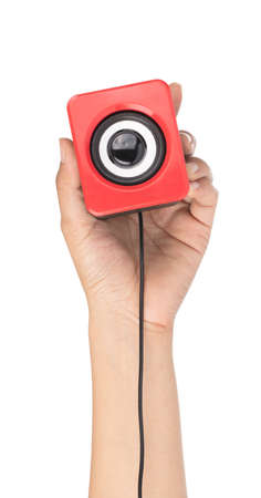 hand holding Modern red speakers isolated on white backgroundの写真素材