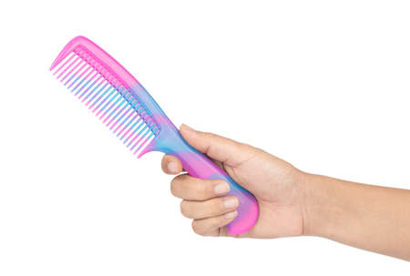 hand holding single hair comb isolated on white background