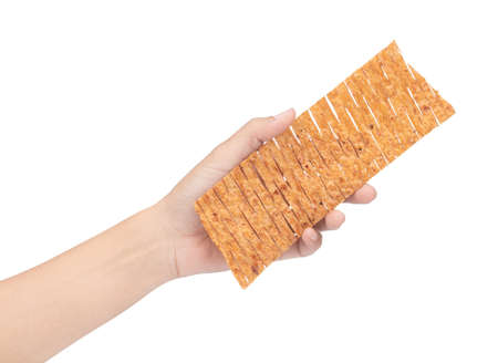 hand holding spicy crispy squid isolated on white backgroundの写真素材