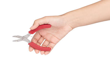 hand holding red side cutting pliers isolated on a white background