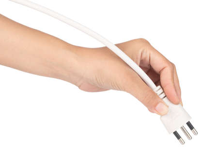 Hand holding Power Cable 3-Pin Electrical Plug on white backgroundの写真素材