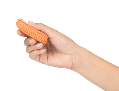 hand holding orange wool yarn isolated on white background