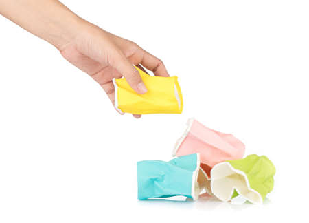 hand holding distorted of cup papers isolated on white background