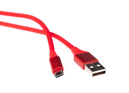 Red USB cable for smartphone isolated on white background.