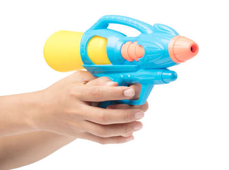 Gun water toy on hand isolated on a white background