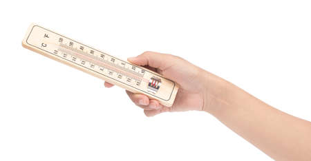 hand holding thermometer on wooden base isolated on white background