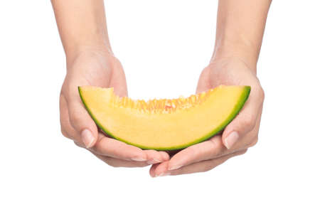 hands holding Sliced Cantaloupe melon Isolated on White Background