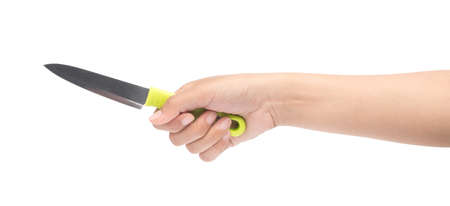 hand holding green knife isolated on white background