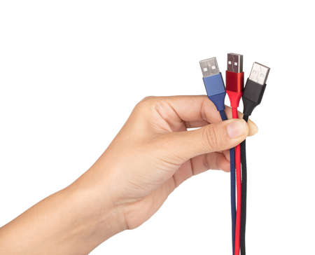hand holding set of USB cable for smartphone isolated on white background.
