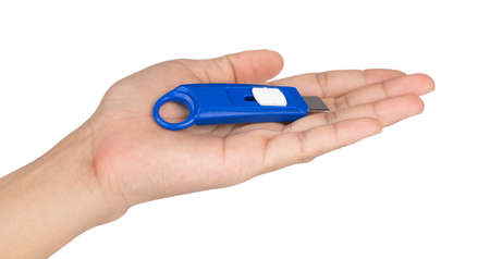 Hand Holding Use Stationery Knife Cutter isolated on a white background.