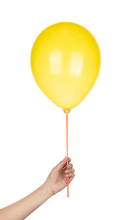 Hand holding Yellow Rubber Balloon isolated on a white background.の写真素材