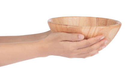 Hand holding Wood bowl isolated on white backgroundの写真素材