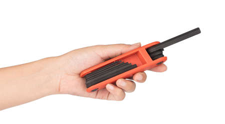 hand holding hexagon wrenches set isolated against a white background.
