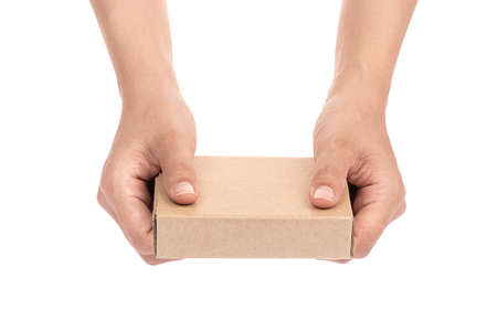 hand holding brown paper box package isolated on white background