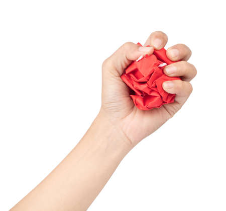 Hand Squeezing Crumbled paper isolated on a white backgroundの写真素材