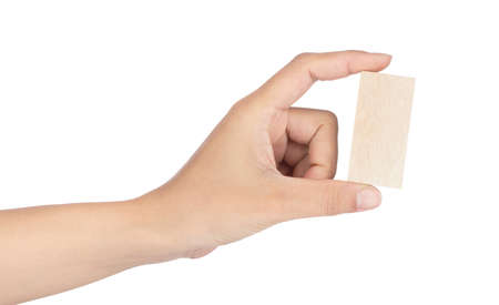Hand holding wooden block isolated on white backgroundの写真素材