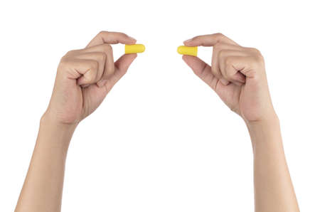 Hand holding Ear plugs isolated on white background.の写真素材