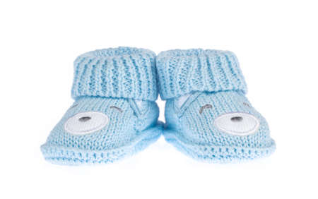 Blue baby booties isolated on white backgroundの写真素材