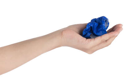 Hand holding Crumpled up piece of Paper isolated on white background