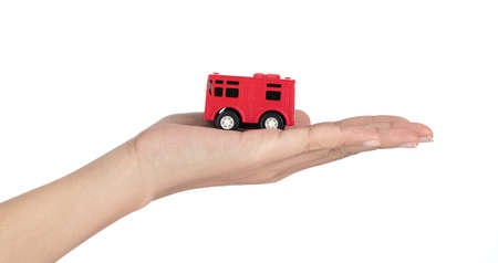 hand holding bus toy kids isolated on a white background.の写真素材