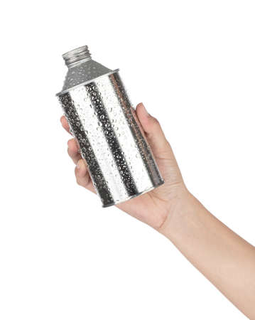 Hand holding Aluminum bottle with Water Drops isolated on white backgroundの写真素材