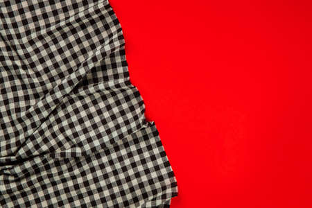 black checkered tablecloth on red background