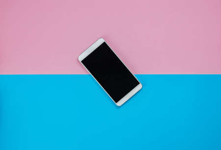 Smartphone With Blank Screen on a pink and blue backgroundの写真素材