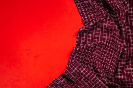 red checkered tablecloth on red background
