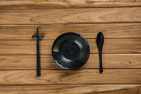 dish stoneware rests on wooden tableの写真素材