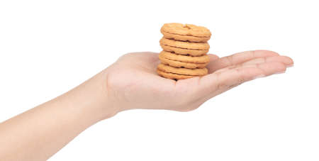 hand holding Sandwich biscuits, filled with jam isolated on white backgroundの写真素材